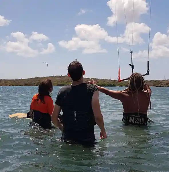 Two instructors at JBay Kiteboarding Curacao guiding kiteboarding lessons in Curaçao